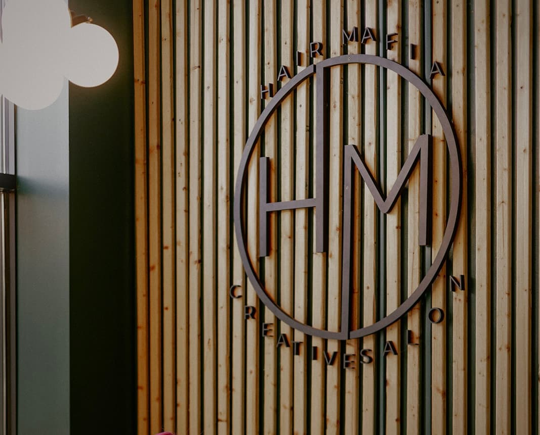 Hair Mafia logo on the salon wall