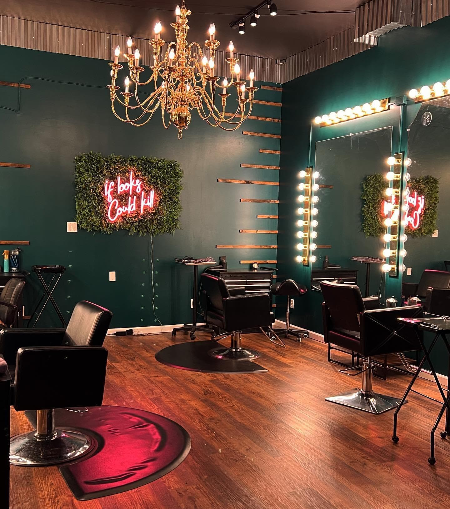 Hair Mafia salon interior with emerald walls and If Looks Could Kill neon sign