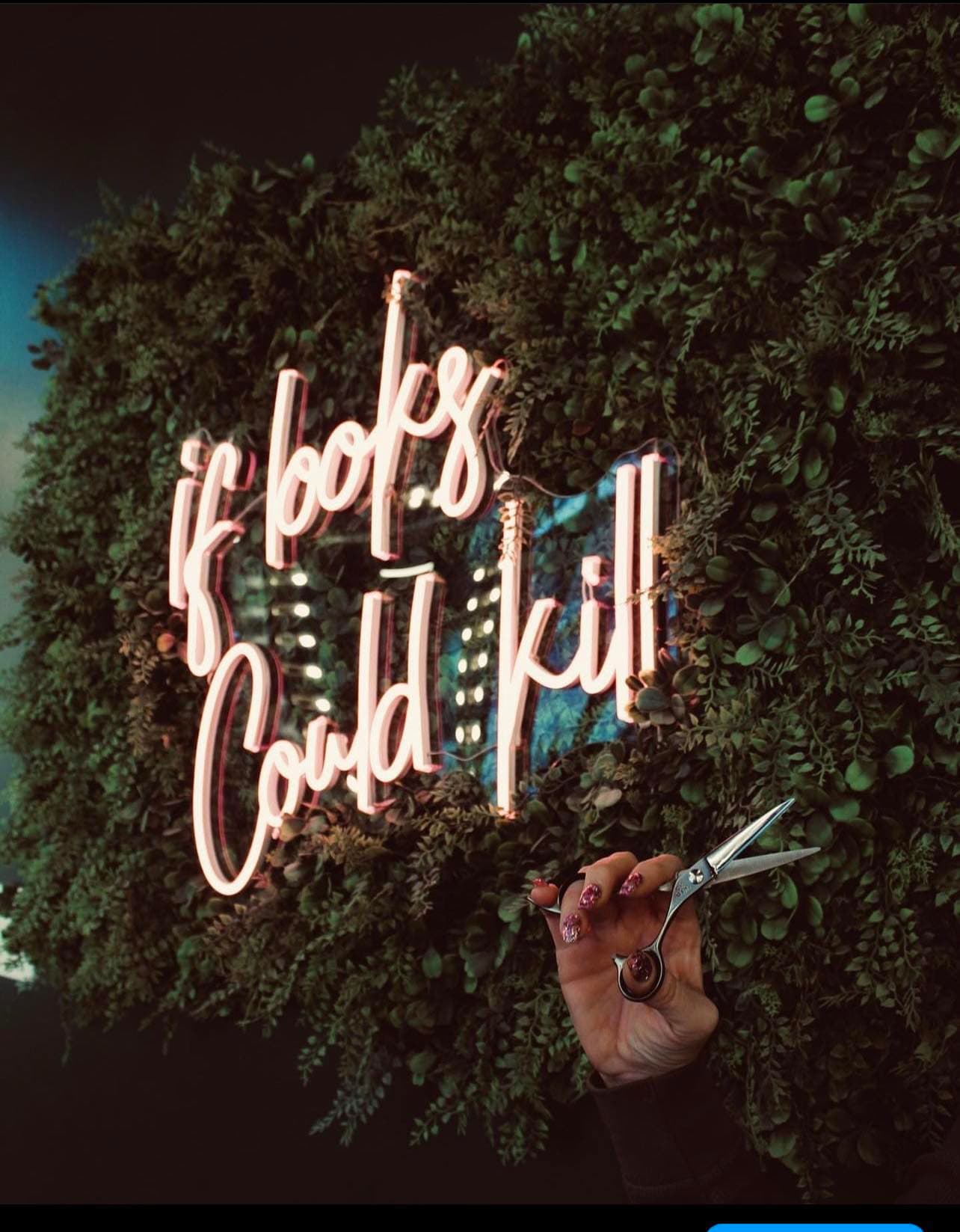 If Looks Could Kill neon sign inside Hair Mafia
